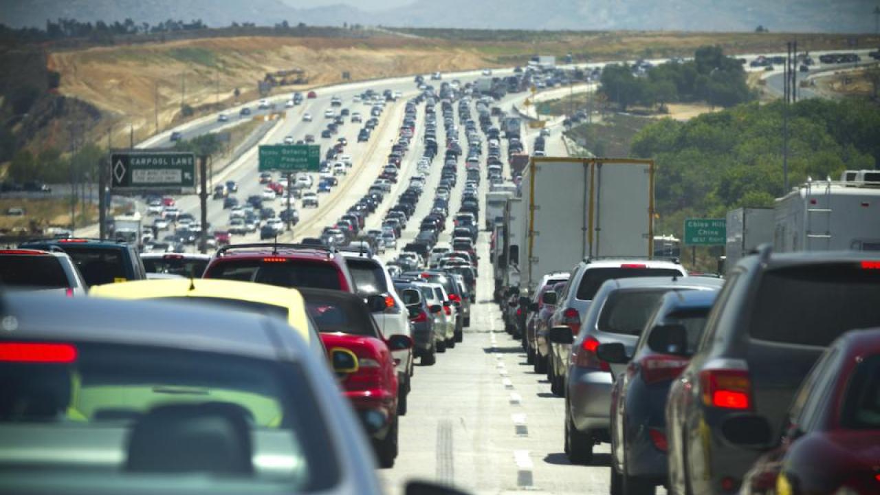 Cars lined up in traffic | Getty